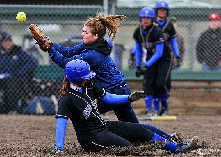 Glacier&#146;s Baylee Quay tries to make a play as Missoula Big Sky&#146;s Kelsey LaVaute slides safely into third in the fourth inning at Kidsports Complex Thursday afternoon.