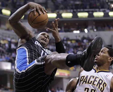 &lt;p&gt;Orlando Magic forward Glen Davis, left, grabs a rebound in front of Indiana Pacers forward Danny Granger during the first half of the second game of an NBA first-round playoff basketball series, in Indianapolis, Monday, April 30, 2012. (AP Photo/Michael Conroy)&lt;/p&gt;