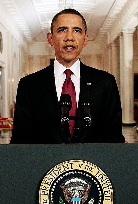 President Barack Obama reads his statement to photographers after making a televised statement on the death of Osama bin Laden from the East Room of the White House in Washington, Sunday, May 1, 2011.