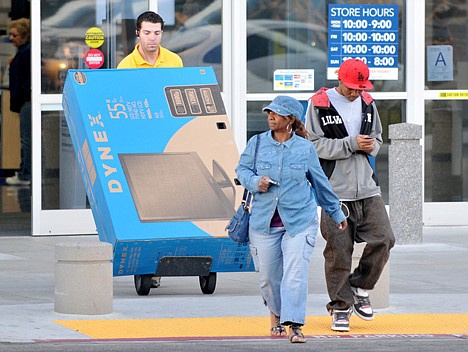 &lt;p&gt;Shoppers at Best Buy leave the store as an employee walks a big screen to their car at Best Buy in Victorville, Calif, on Friday, March 30, 2012. U.S. consumers boosted their spending in February by the most in seven months, raising expectations for stronger growth at the start of the year. Consumer spending rose 0.8 percent last month, as their income barely grew, the Commerce Department said Friday. (AP Photo/The Victor Valley Daily Press, David Pardo)&lt;/p&gt;