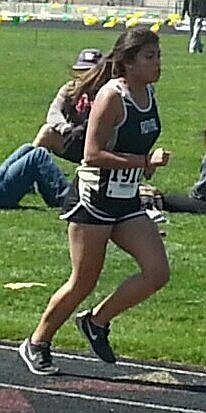 Ana Villafana charges toward the finish line in the girls 3200. She finished ninth in that race and in the 800 and 1600.