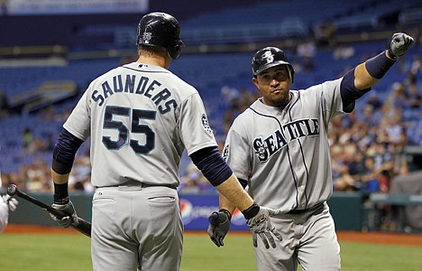 &lt;p&gt;Seattle Mariners' Miguel Olivo, right, celebrates with Michael Saunders after Olivo hit a second-inning home run off Tampa Bay Rays starting pitcher Jeremy Hellickson during a baseball game Monday, April 30, 2012, in St. Petersburg, Fla. (AP Photo/Chris O'Meara)&lt;/p&gt;