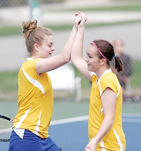 <p>Dani Hawthorne and Cloie Boardner congratulate one another after defeating Columbia Falls 6-2, 6-2 in No. 2 doubles action 4-28-14.</p>