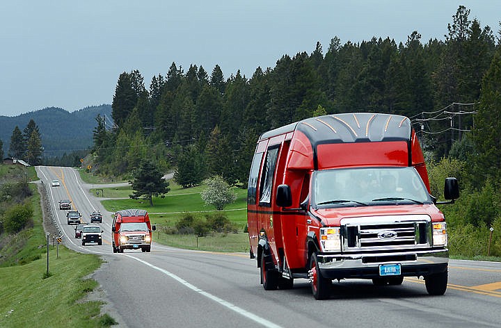 &lt;p&gt;Two of the new red buses make their way north of U.S. 93 taking Lorrie Gomez&#146;s fourth grade class to Glacier on Friday morning, April 29, near Lakeside.&lt;/p&gt;