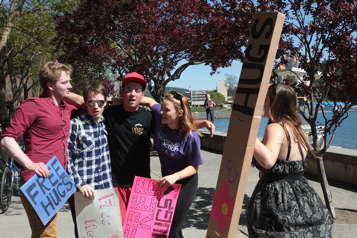 &lt;p&gt;Bryan Anderson, center, of Rathdrum receives a group hug from North Idaho College students Sunday as the students made their way through downtown Coeur d&#146;Alene to spread the love and celebrate &#147;Global Love Day,&#148; as well as Coeur d&#146;Alene&#146;s &#147;Choose Love Over Fear&#148; day. The NIC students, from left surrounding Anderson: Asher Rose, AJ Konda, Nicole Hill and Mallory Gregson running over to join in.&lt;/p&gt;