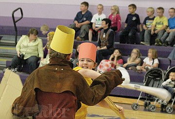 &lt;p&gt;Trey Manry fends off an attacker during the ball and chain melee event at Linderman Elementary School's medieval fair last Friday.&lt;/p&gt;