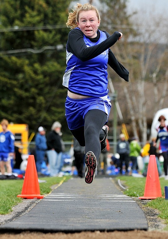 Columbia Falls' Tiana Burns jumps into the air as she flies toward the pit during the A.R.M Invitational in Whitefish Saturday morning.