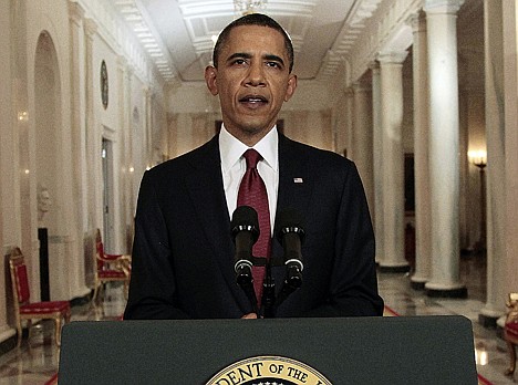 &lt;p&gt;President Barack Obama reads his statement to photographers after making a televised statement on the death of Osama bin Laden from the East Room of the White House in Washington on Sunday night.&lt;/p&gt;