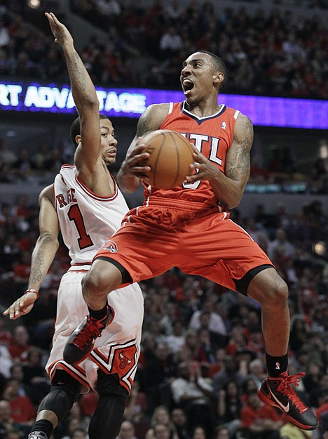 &lt;p&gt;Atlanta's Jeff Teague, right, drives to the basket against Chicago's Derrick Rose during the second quarter in Game 1 of a second-round playoff series game in Chicago, Monday.&lt;/p&gt;