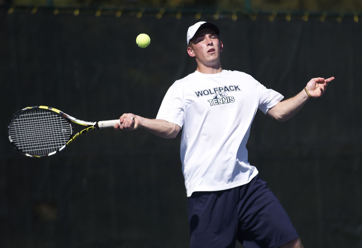 &lt;p&gt;Glacier senior Spencer Johnson smashes a return against Flathead's Ridge Lembke during the No. 1 singles match at Flathead Valley Community College on Tuesday. Johnson won the match 6-0, 6-0 to set the Glacier wins record. (Aaric Bryan/Daily Inter Lake)&lt;/p&gt;