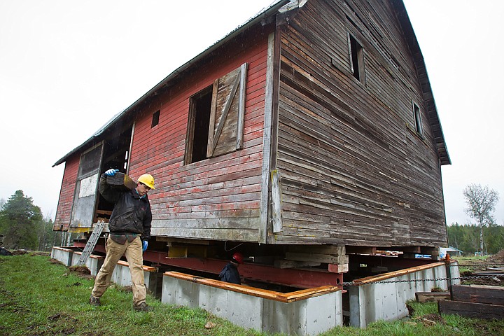 &lt;p&gt;SHAWN GUST/Press Doug Mitchell, foreman for Catlow Structural Lifting, passes a barn Thursday while hauling a block to be used in the move of the structure at The Vintage Barn in Rathdrum. The company moved the barn several hundred feet to a new foundation.&lt;/p&gt;