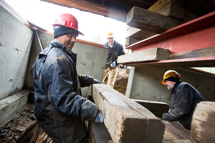 &lt;p&gt;SHAWN GUST/Press Laborers Aaron Babb, left, and Doug Bell, build up blocks while making preparations to position the Rathdrum barn over its new foundation while foreman Doug Mitchell, center, offers advice.&lt;/p&gt;