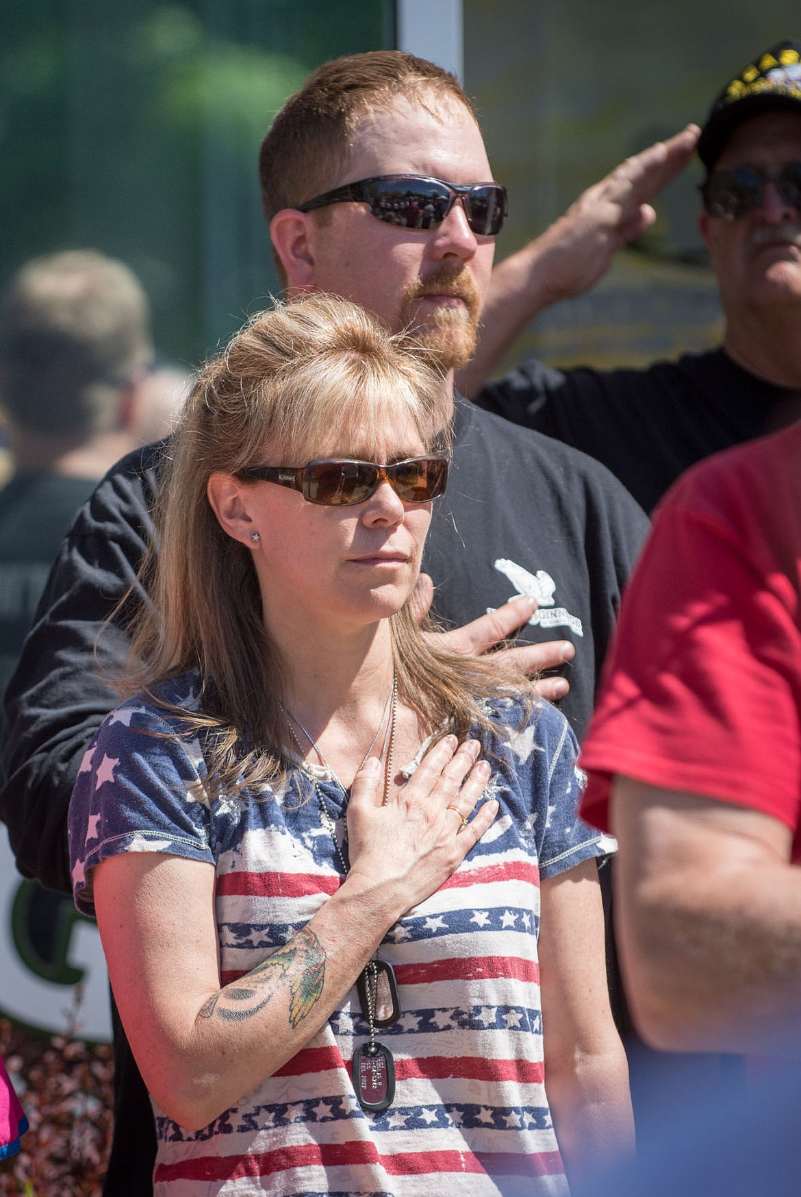 &lt;p&gt;Newby-ginnings founder and director Theresa Hart stands with her husband, James, during the pledge of allegiance at the grand opening Monday.&lt;/p&gt;