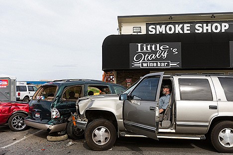 &lt;p&gt;The suspected driver of a multiple car accident that sent a pair to the hospital, sits in an SUV where it came to rest after the incident Friday as emergency workers investigated the scene at Idaho-Washington state line.&lt;/p&gt;