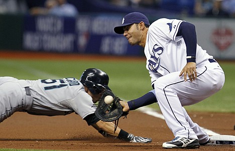 &lt;p&gt;Seattle Mariners' Ichiro Suzuki, of Japan, dives back to first base ahead of a pickoff throw to Tampa Bay Rays first baseman Carlos Pena during the first inning of a baseball game, Wednesday, May 2, 2012, in St. Petersburg, Fla. (AP Photo/Chris O'Meara)&lt;/p&gt;