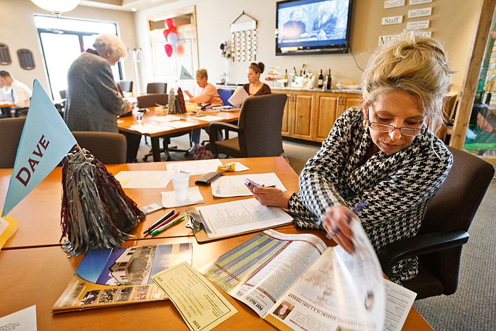 &lt;p&gt;SHAWN GUST/Press Hilde Shetler, with Jobs Plus, cross references literature and lists while working at a membership drive Friday at the Post Falls Chamber of Commerce. Business leaders from the area were working toward a goal of adding at least 25 new members.&lt;/p&gt;