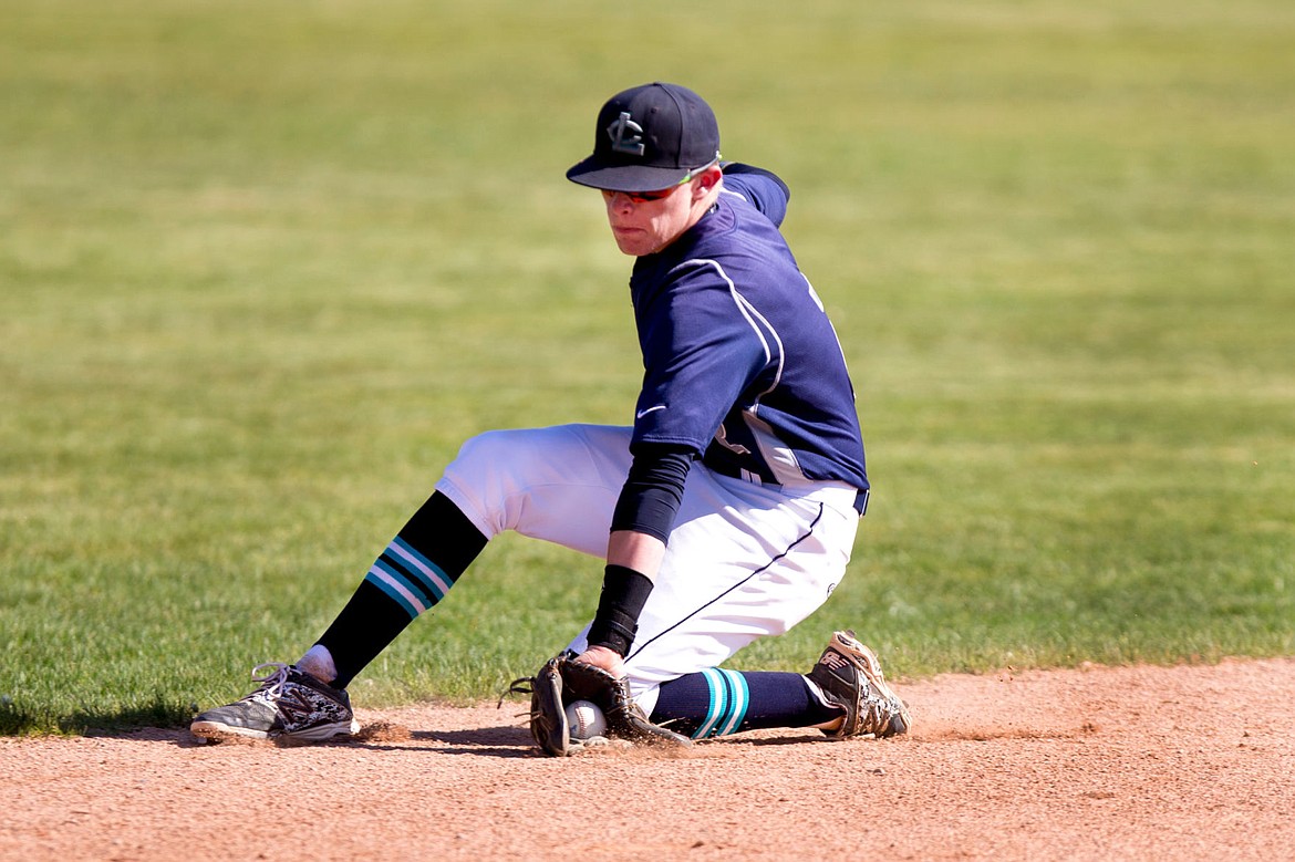 &lt;p&gt;JAKE PARRISH/Press Lake City's Kodie Kolden snags a ground ball hit by a Coeur d'Alene player on Monday at Coeur d'Alene High School.&lt;/p&gt;