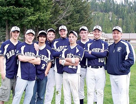 &#151;Photo by MIKE WELAND&lt;br&gt;Being honored at Friday's final game of the season: (l-r) Badgers Chris Nelson, Josh Hawks, Josh Gatchell, Matt Pluid, Kenny Swift, Chris James, Mitch Fortune and Ross Patterson. Coach Tom Turpin said, &quot;It was an absolute thrill to watch these young men grow over the last four years&#133;they will be missed.&quot; Nelson, Hawks, Gatchall, Pluid and Swift have played baseball together since T-ball and Little League.