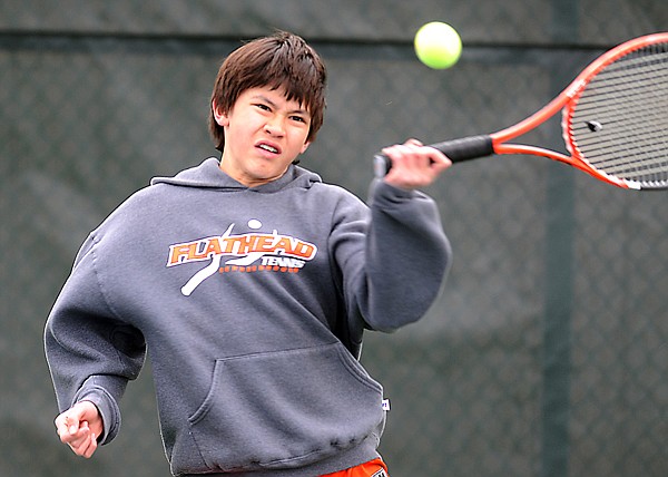 Flathead's Glenn Strickler returns a serve from Glacier&#146;s Kellen Bates during No. 1 singles play on Tuesday at Flathead Valley Community College.