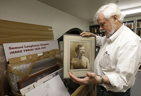 &lt;p&gt;Bob Hirst, general editor of the Mark Twain Project, holds up a photo of Twain at The Bancroft Library at the University of California Berkeley in Berkeley, Calif., Monday.&#160;&lt;/p&gt;