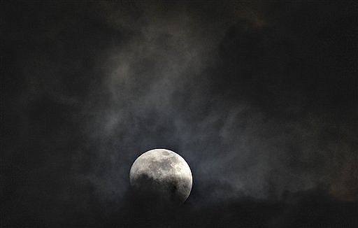 &lt;p&gt;In this Thursday, May 3, 2012, photo, the moon peaks through the clouds in the night sky in Huntsville, Ala. On Saturday, May 5, 2012, the moon will be a &quot;supermoon&quot; or perigee moon as the moon will be at it's closest approach to the earth. It will appear 14 percent larger and 30 percent brighter than normal. (AP Photo/The Huntsville Times, Bob Gathany)&lt;/p&gt;