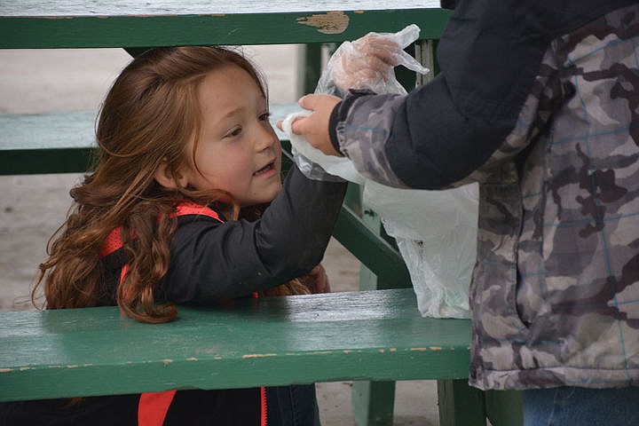 &lt;p&gt;Lara Duran gets down under a picnic table to ensure it is clean.&lt;/p&gt;