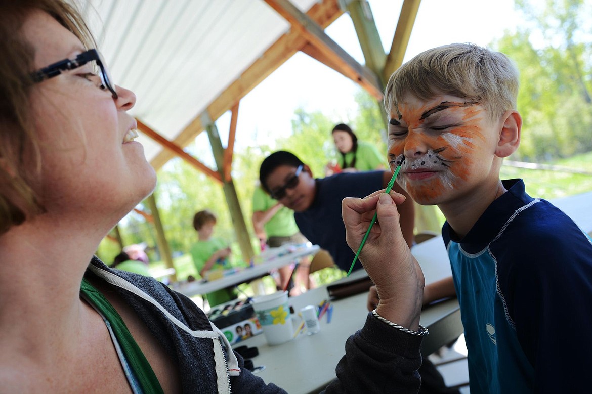 &lt;p&gt;Jayden Anderson flinches as Gel Papyk begins painting a black spot over Anderson's nose. Anderson came down to the event with his friends Sunday afternoon, hoping to find some fun activities and learn a little about their community.&lt;/p&gt;