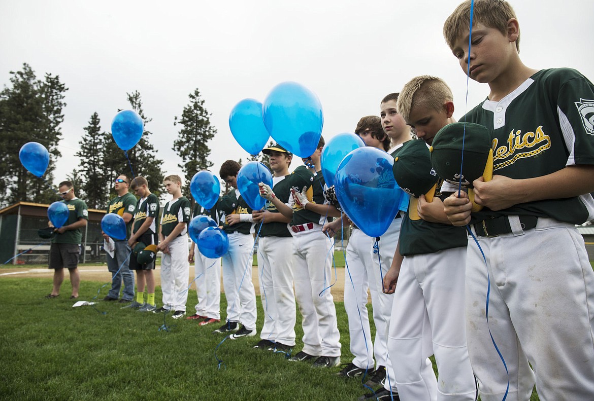 &lt;p&gt;The Athletics Post Falls Little League team remembers Coeur d'Alene Police Sergeant Greg Moore a year later with 27 seconds of silence before releasing balloons prior to the beginning of their game on Wednesday.&lt;/p&gt;