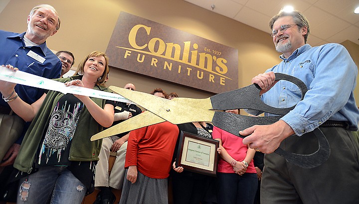 &lt;p&gt;B.J. Lupton, president of the Evergreen Chamber of Commerce, left, looks on as Scott Hansen, general manager of the Conlin's Furniture Evergreen store, cuts the ribbon at the grand opening on Friday, May 2. Conlin's, which became Al's Furniture in 2009, is once again Conlin's. (Brenda Ahearn/Daily Inter Lake)&lt;/p&gt;