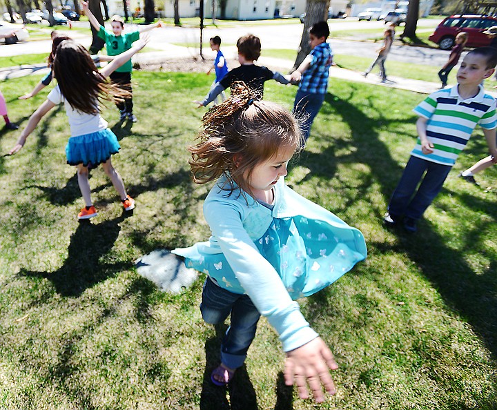 &lt;p&gt;Hedges first grader Ella Kyger and other students surrounded the school as they took part in &quot;Drop Everything and Move&quot; on Thursday, May 1, in Kalispell. The program is part of physical fitness month. (Brenda Ahearn/Daily Inter Lake)&lt;/p&gt;