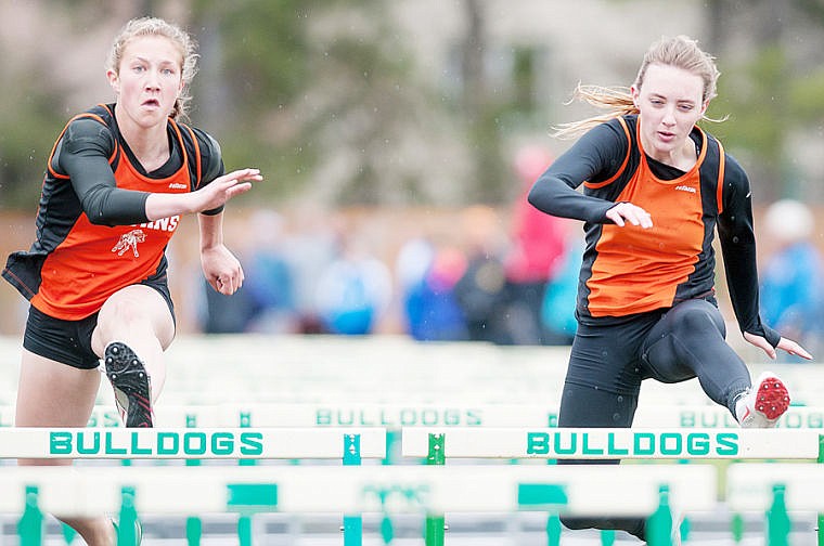 &lt;p&gt;Flathead's Rhiannon Sturgess (right) races in the 100-meter hurdles Saturday during the ARM track meet at Whitefish High School. May 3, 2014 in Whitefish, Montana. (Patrick Cote/Daily Inter Lake)&lt;/p&gt;