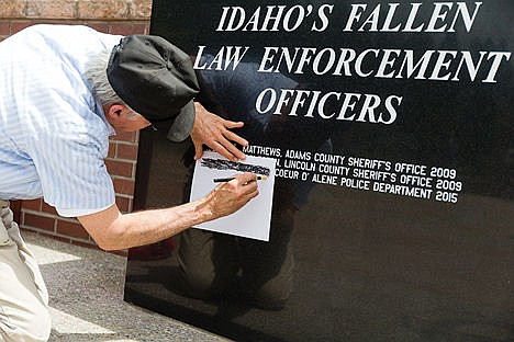 &lt;p&gt;&#160;Bill Green, of Coeur d&#146;Alene uses a pencil to copy Sgt. Greg Moore&#146;s name following the ceremonies at the Fallen Heroes Plaza. (Taken May 15, 2015)&lt;/p&gt;