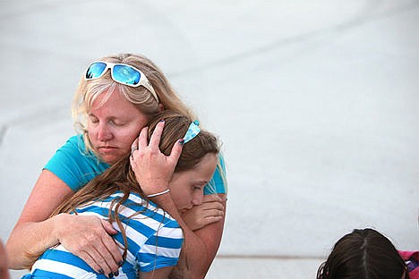 &lt;p&gt;Heather Ingram holds daughter Emmalea,11, at the gathering in honor of Sgt. Moore at McEuen Park on May 6, 2015.&lt;/p&gt;