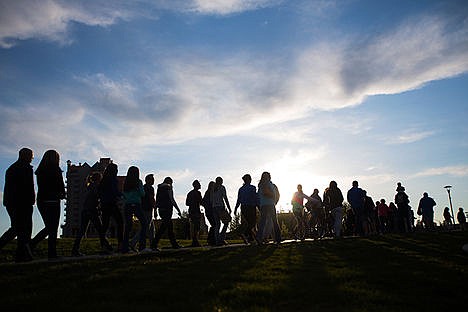 &lt;p&gt;Hundreds peacefully march through McEuen Park in Coeur d&#146;Alene Wednesday, May 6, 2015, to honor Sgt. Greg Moore, a Coeur d'Alene Police offiicer who was killed in the line of duty Tuesday.&lt;/p&gt;