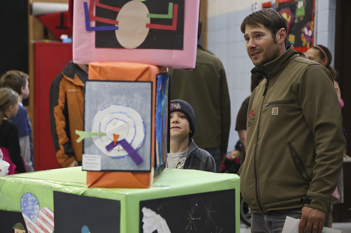 &lt;p&gt;&#160;Corben Carlson, 7, and his dad, Shea Carlson, admire the art work during Cherry Valley's Night of the Arts.&lt;/p&gt;