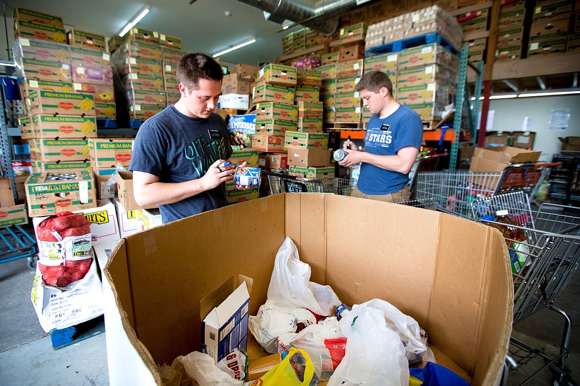 &lt;p&gt;Post Falls Food Bank volunteers Elder Hunter, left, and Elder Jefferies sort donated food items on Wednesday at the bank's 415 E 3rd Ave. location. Now that the bank is adapting a market-style approach, it needs roughly double the number of volunteers to keep it running efficiently.&lt;/p&gt;