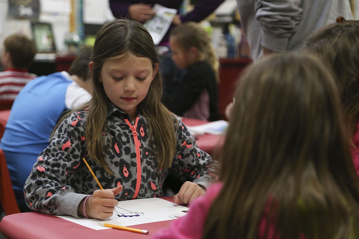 &lt;p&gt;Ryleigh Brumwell, a second grader at Cherry Valley, paints during the art night at the school Thursday.&lt;/p&gt;