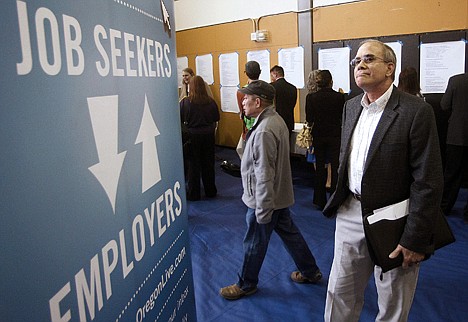 &lt;p&gt;Job seeker Alan Shull attends a job fair in Portland, Ore., on Tuesday. The Labor Department said Friday, May 4, 2012, that the economy added just 115,000 jobs in April.&lt;/p&gt;