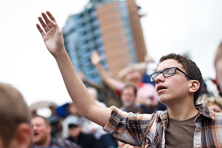 &lt;p&gt;Ian Van Ostrand, 14, sings along with a musical number performed Thursday at Coeur d'Alene City Hall where approximately 200 gathered to recognize the 60th annual National Day of Prayer.&lt;/p&gt;