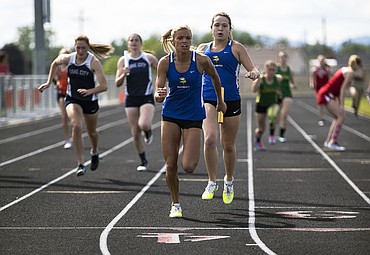 <p>LOREN BENOIT/Press Coeur dAlene High senior Emily Callahan, middle, receives the baton from Taryn Horvath during Thursdays District 1 All-Star meet. The Coeur dAlene girls won the 4x200 relay in 1:44.42, with Callahan in the anchor leg.</p>