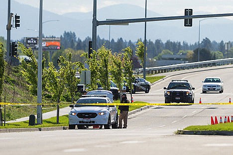 &lt;p&gt;Emergency personnel from the Kootenai County Sheriff&#146;s Office, Post Falls Police Department, Idaho State Police and Washington State Patrol process the scene where Coeur d&#146;Alene Police Department&#146;s Sgt. Greg Moore&#146;s patrol car was left after a high-speed chase in the early morning hours on Tuesday. The chase began when a Post Falls police officer spotted the stolen car on Seltice Way near McGuire Road after the suspect allegedly shot Sgt. Moore and fled in the patrol vehicle, ending up on Pointe Parkway near the state line.&lt;/p&gt;