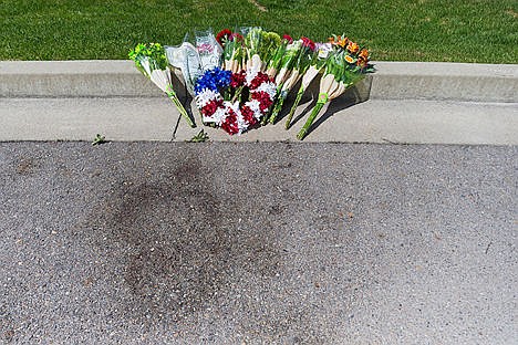 &lt;p&gt;Hayden Meadows Elementary students placed flowers near the scene where Sgt. Greg Moore was shot on Wilbur Avenue in Coeur d&#146;Alene.&lt;/p&gt;