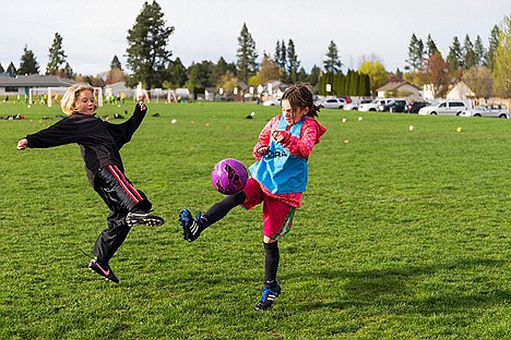 &lt;p&gt;Ella Morton, left, and Sam Beamis, players for a Coeur d&#146;Alene Sting Soccer Club U-8 girls team, go up for a ball Monday during practice drills at the soccer fields south of Hayden Meadows Elementary School. The Coeur d'Alene School District's fee structure for outside groups to rent fields, classrooms and gyms was reviewed Monday by trustees who will consider whether to increase the hourly use fees. The current cost to rent a field is $3.75 for up to four hours.&#160;&lt;/p&gt;