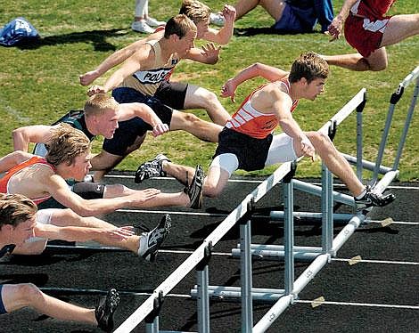 Flathead&#146;s Clint Manning leads the pack early in the 110-meter hurdles during the Archie Roe track meet Saturday in Kalispell. Following closely behind are Lane Hamilton of Missoula Big Sky, left, C.J. Manning of Flathead, Cort Rogers of Whitefish, Cody Doyle of Polson and Curtis Moen of Flathead. Rogers won the race.