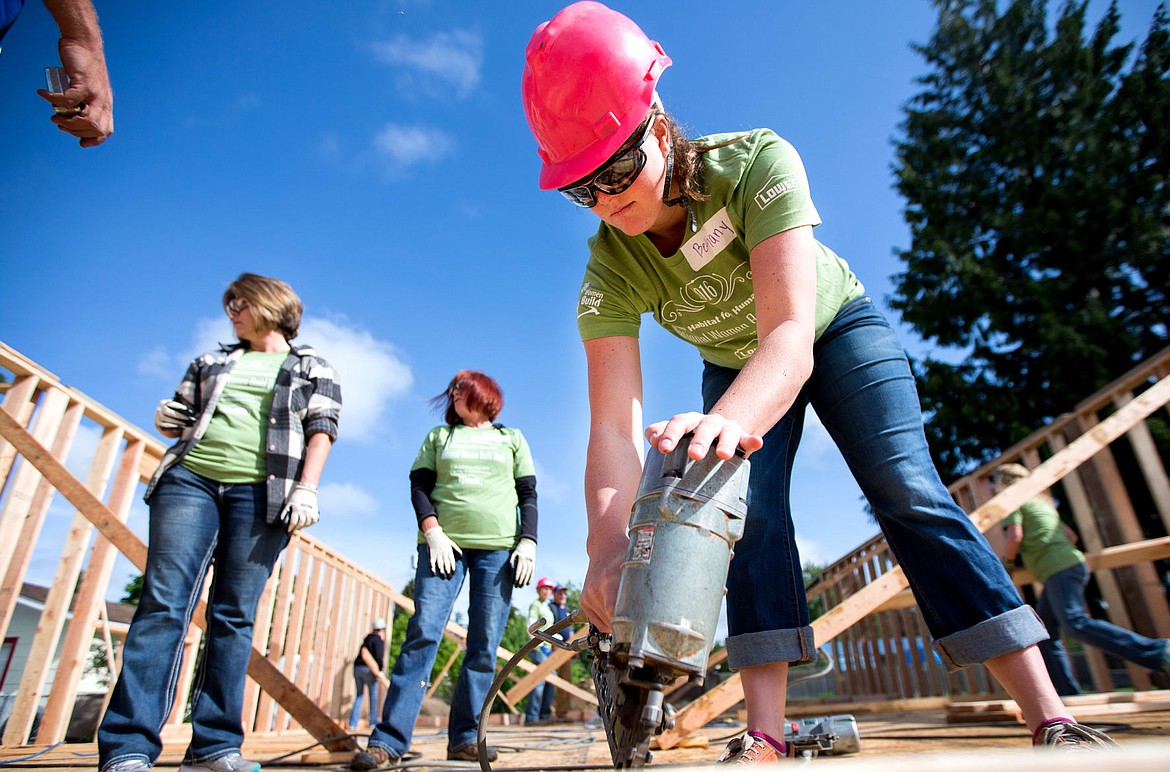 &lt;p&gt;Coeur d'Alene Press reporter Bethany Blitz uses a nail gun on Thursday to drive nails into the framework of a home for Habitat of Humanity in Post Falls.&lt;/p&gt;