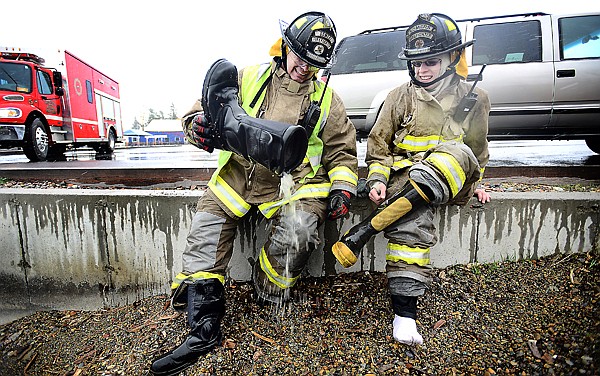 &lt;p&gt;Somers Volunteer Firefighters Kevin Dickerson, left, and Everest George pour water from their boots after wading out into the cold water of Flathead Lake to help the Search and Rescue boat launch a search on Monday afternoon, April 29, in Lakeside.&lt;/p&gt;