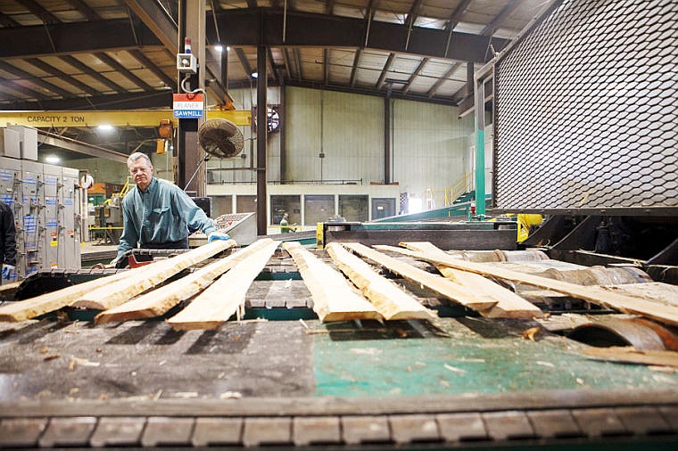 &lt;p&gt;U.S. Sen. Max Baucus guides lumber into the board edger Wednesday morning at Plum Creek&#146;s Evergreen sawmill. This was Baucus&#146; 94th &#147;work day&#148; in Montana.&lt;/p&gt;