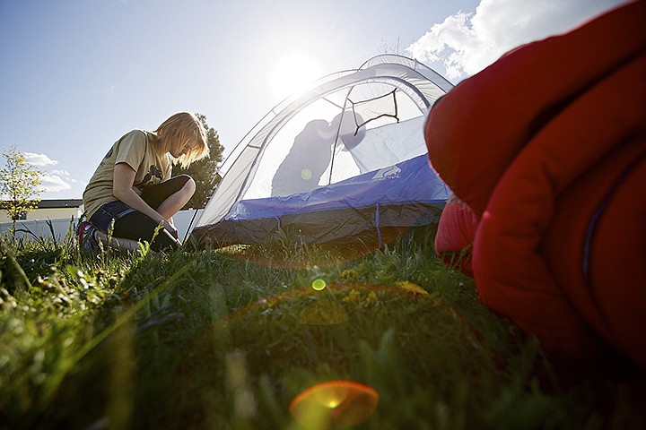 &lt;p&gt;JEROME A. POLLOS/Press Mikayla Jensen, 18, foreground, and her friend Andi Graf, 17, team up to assemble a tent at the Post Falls American Legion as they prepare for their overnight outing for the Post Falls High School &quot;Get a C.L.U.E. About Homelessness&quot; event Friday. About 30 students participated in the event organized by the school's Key Club. Students were provided with a 1,500-calorie, 24-hour diet, listened to guest speakers discuss the homeless issue in the area and the students will work on a service project at the Post Falls Food Bank after a food drive at the Post Falls Super 1 Foods at 1 p.m. today.&lt;/p&gt;