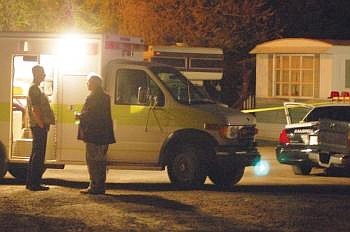 Emergency workers and law-enforcement officials were called Monday night to a trailer home in Kalispell where a man was found shot to death. Nick Ledden/Daily Inter Lake