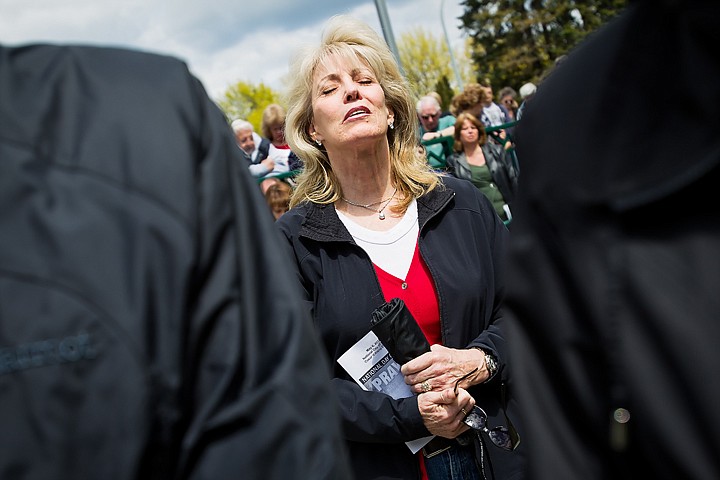 &lt;p&gt;Mary Cate, of Hayden, joins hundreds at Coeur d'Alene City Hall Thursday to recognize the National Day of Prayer.&lt;/p&gt;